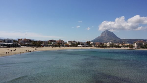 Sea, beach, mountain, sky, clouds people