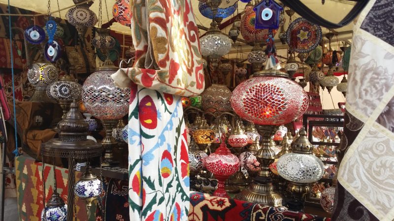 Red, blue, yellow, green, orange lamps and tapestries.