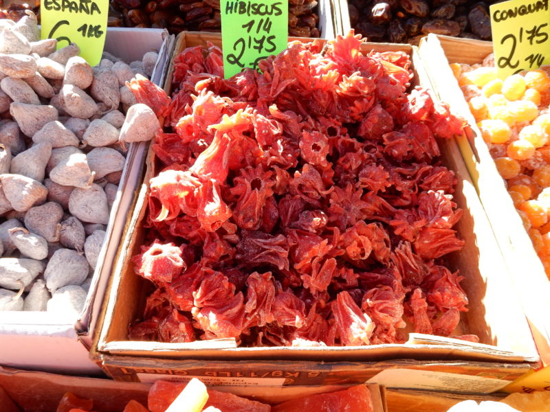 Market, red hibiscus sweetened and dried to eat.