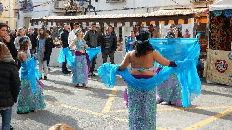 Blue scanty dresses and scarves. Dancing ladies.